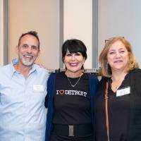 President Mantella posing for photo with 4 other event guests